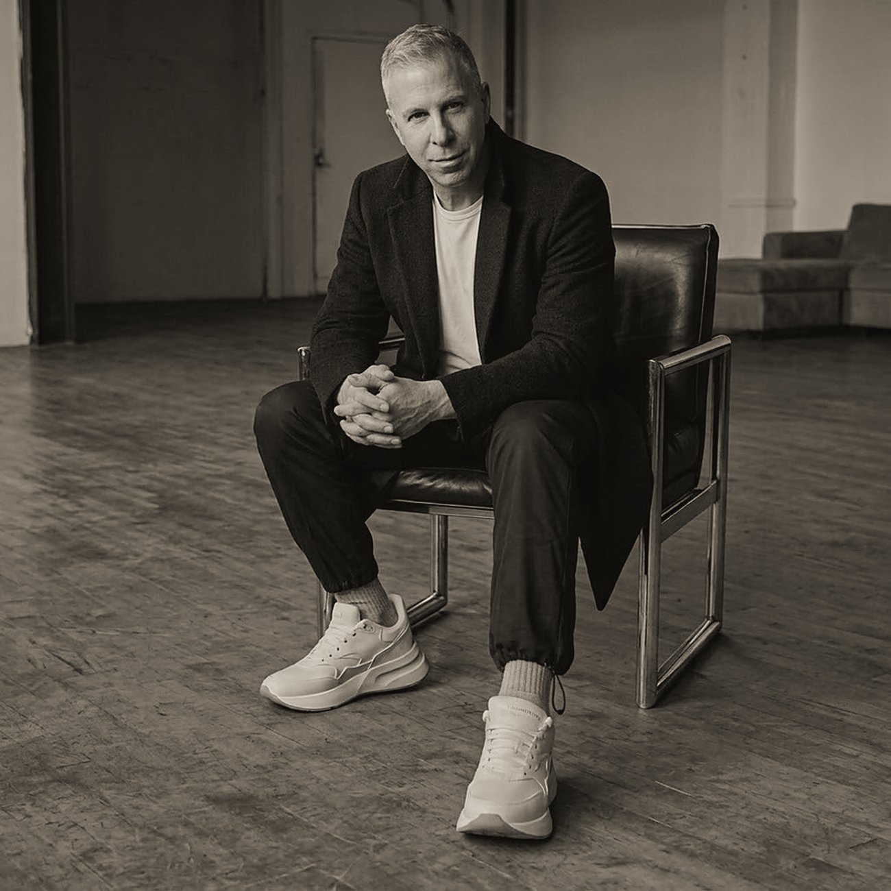 Chris Kypriotis seated in a leather chair